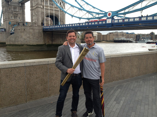 Pete de Bourcier and Synergy Aviation MD Glen Heavens with an Olympic torch during the last few kilometres of the Monaco - Mayfair walk.